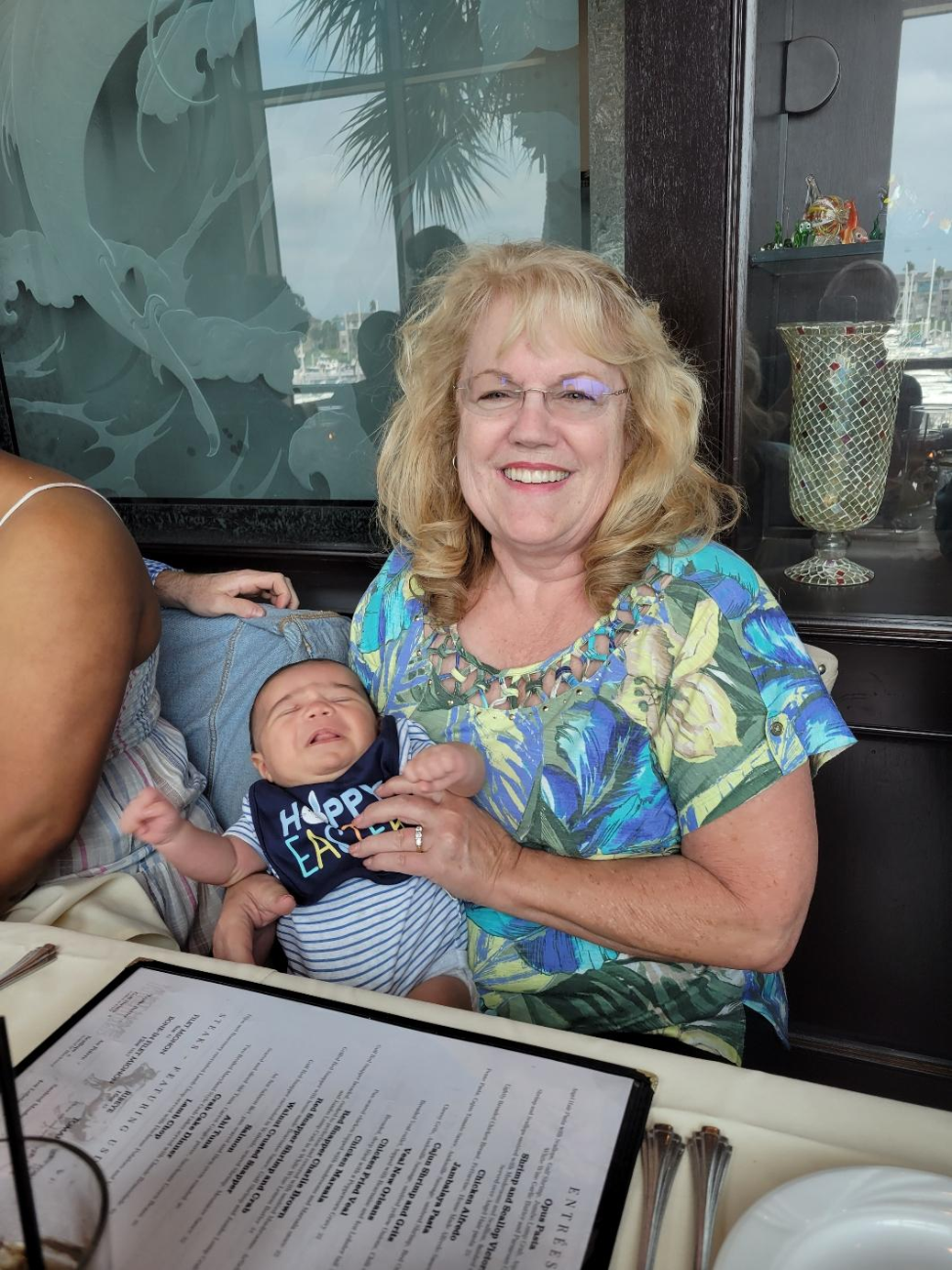 Barbara Smith holding her grand baby